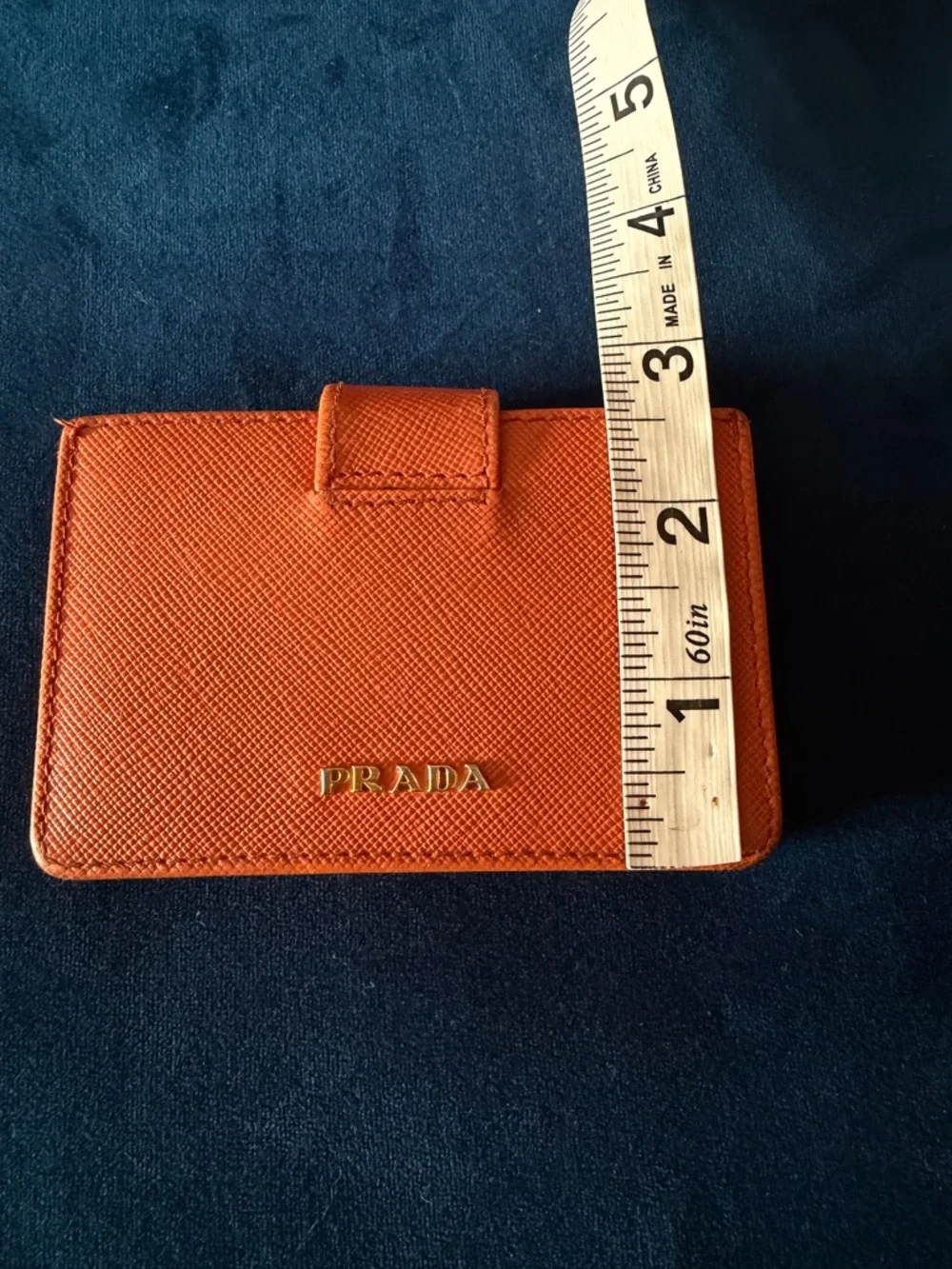 Orange Prada Saffiano Leather accordion card holder.